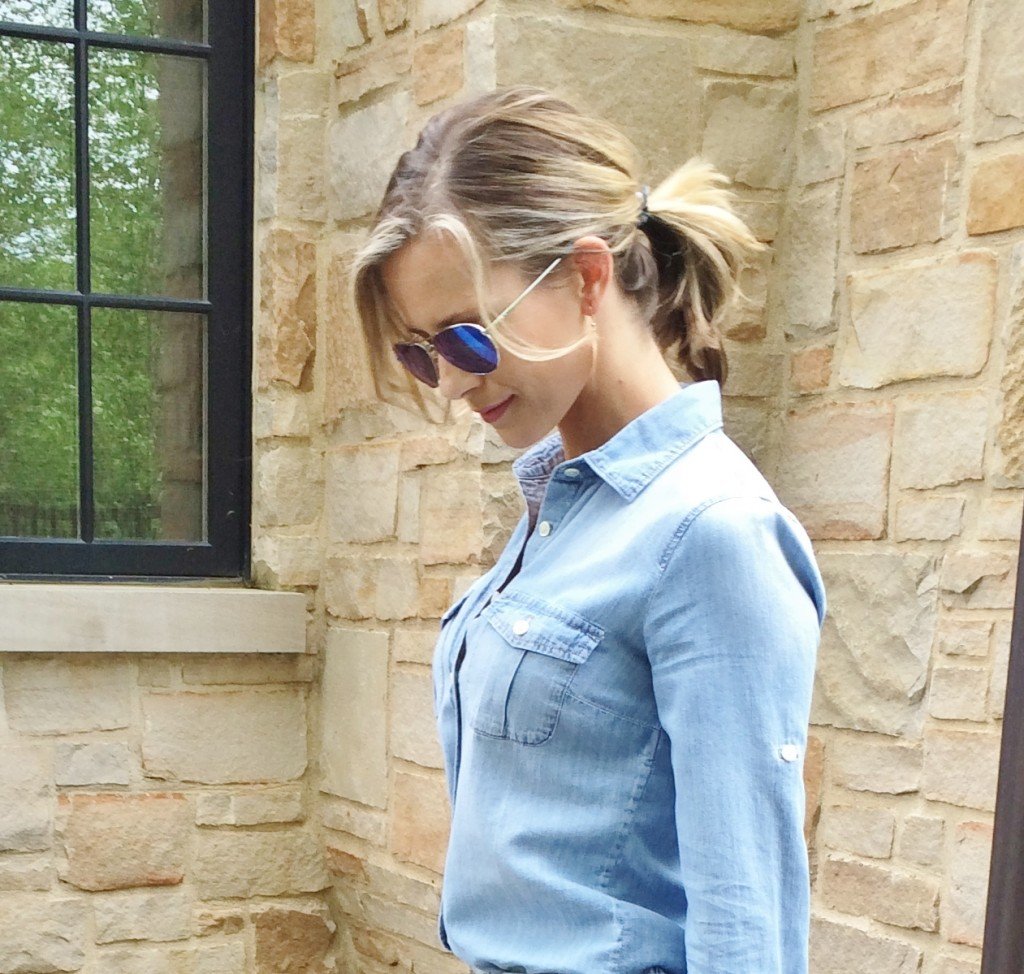 Denim on denim, wedges, and blue handbag