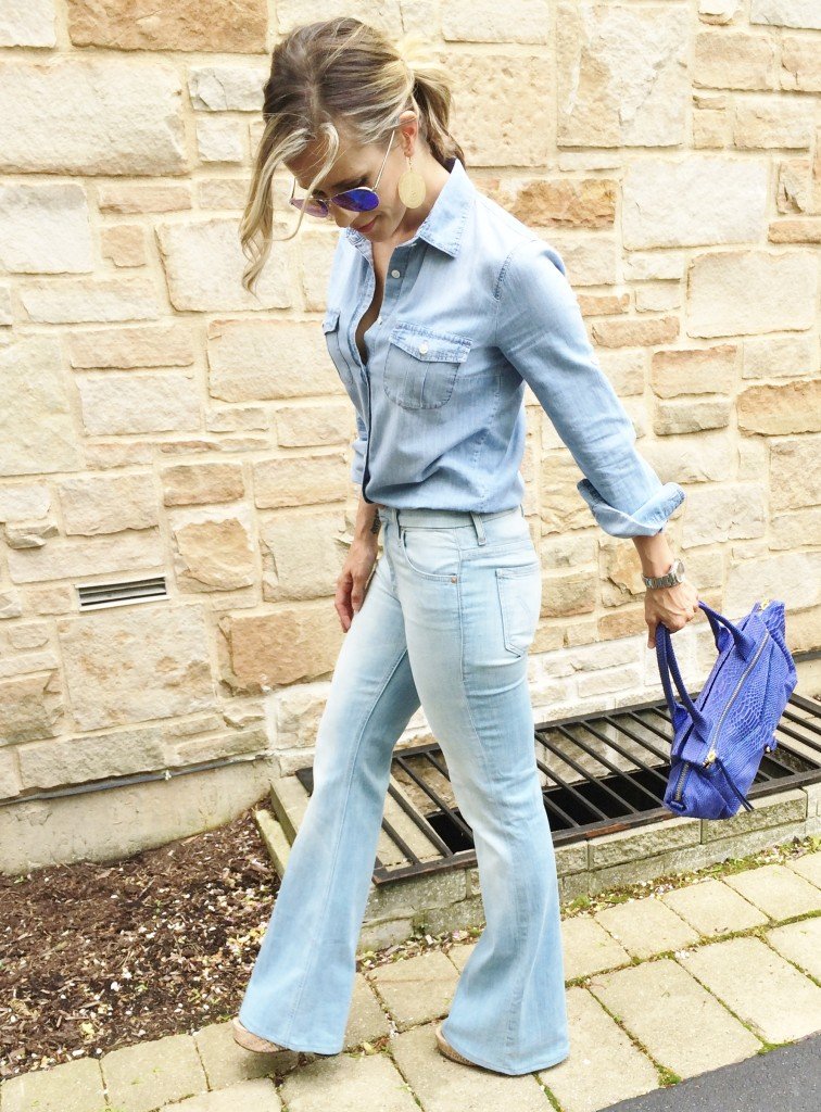 Denim on denim, wedges, and blue handbag