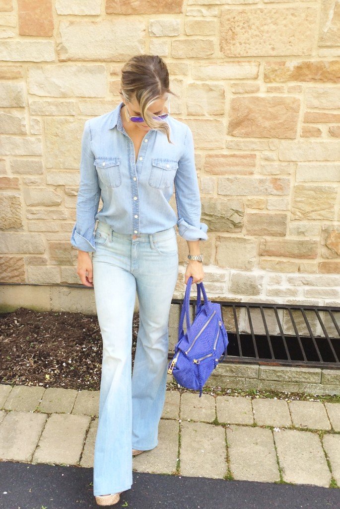 Denim on denim, wedges, and blue handbag