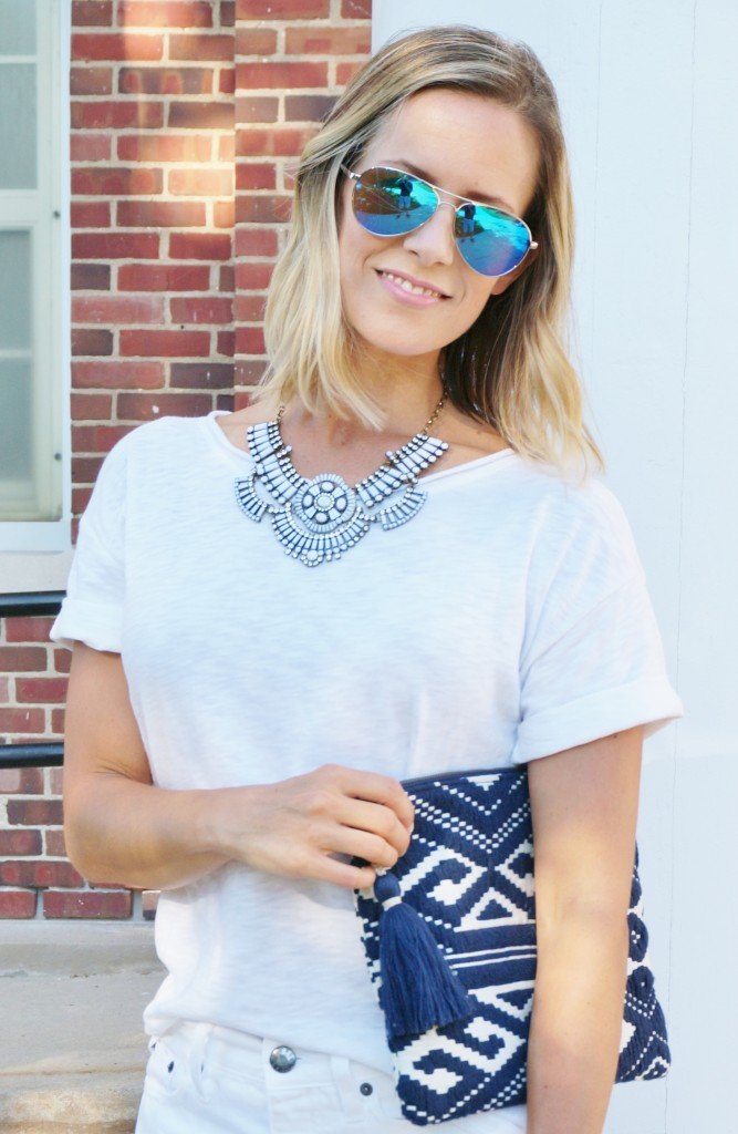 White outfit: white tee, white denim, clutch, Converse