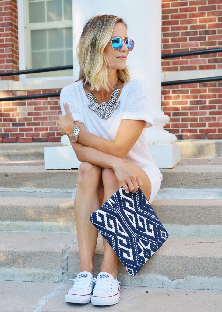 White outfit: white tee, white denim, clutch, Converse
