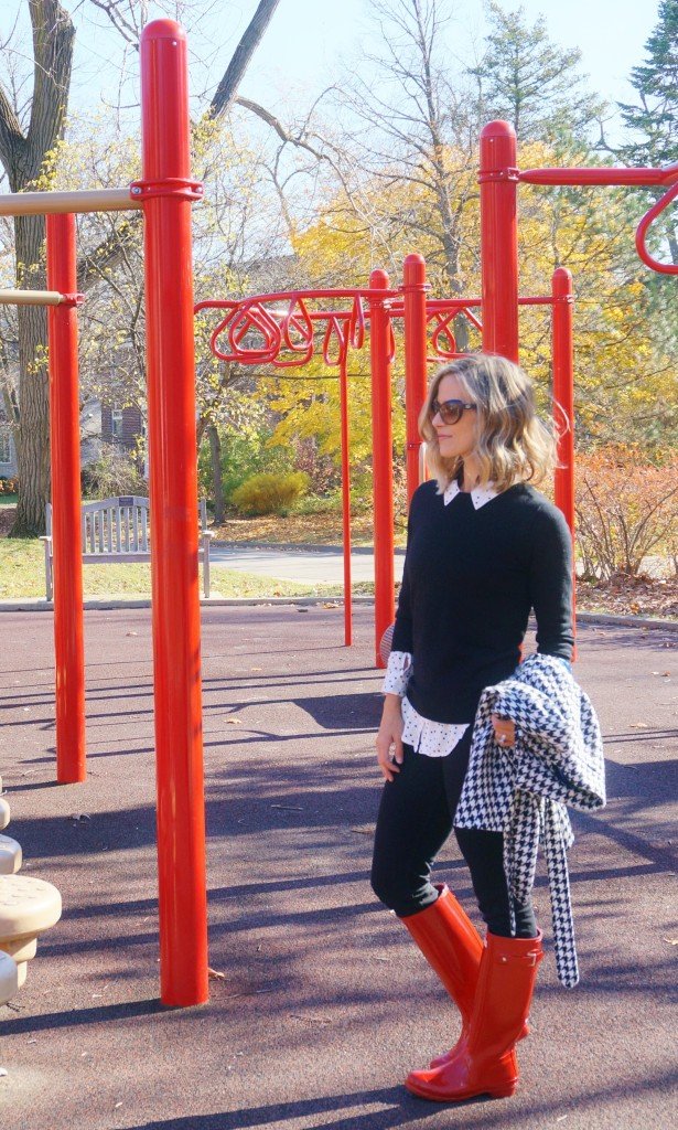 Houndstooth poncho, leggings, and red rain boots