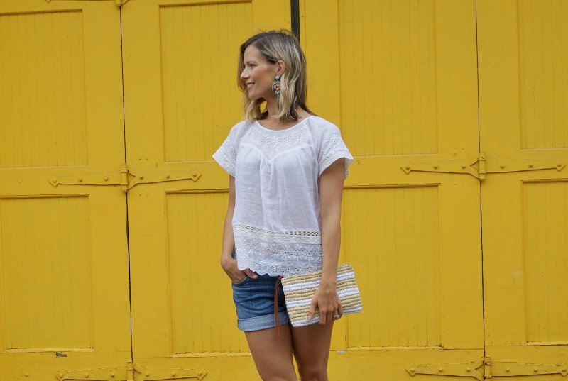 Eyelet top, denim shorts, sandals, clutch