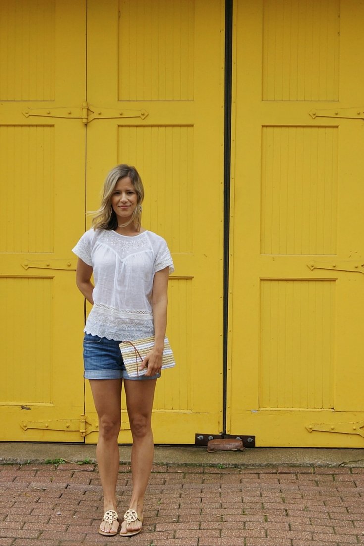 Eyelet top, denim shorts, sandals, clutch