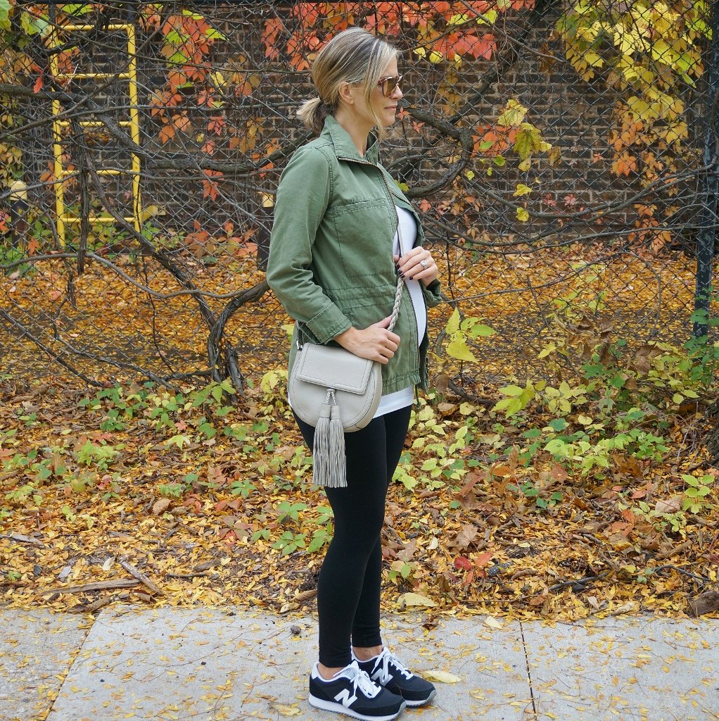Bump style: tee, army jacket, leggings, crossbody, sneakers
