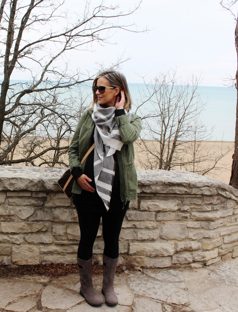 Army jacket, black tee, leggings, scarf, crossbody, rain boots