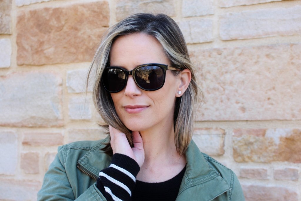 Postpartum style: striped tee, leggings, green army jacket, sneakers