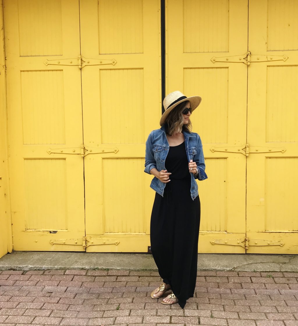 Black maxi dress, denim jacket, straw hat