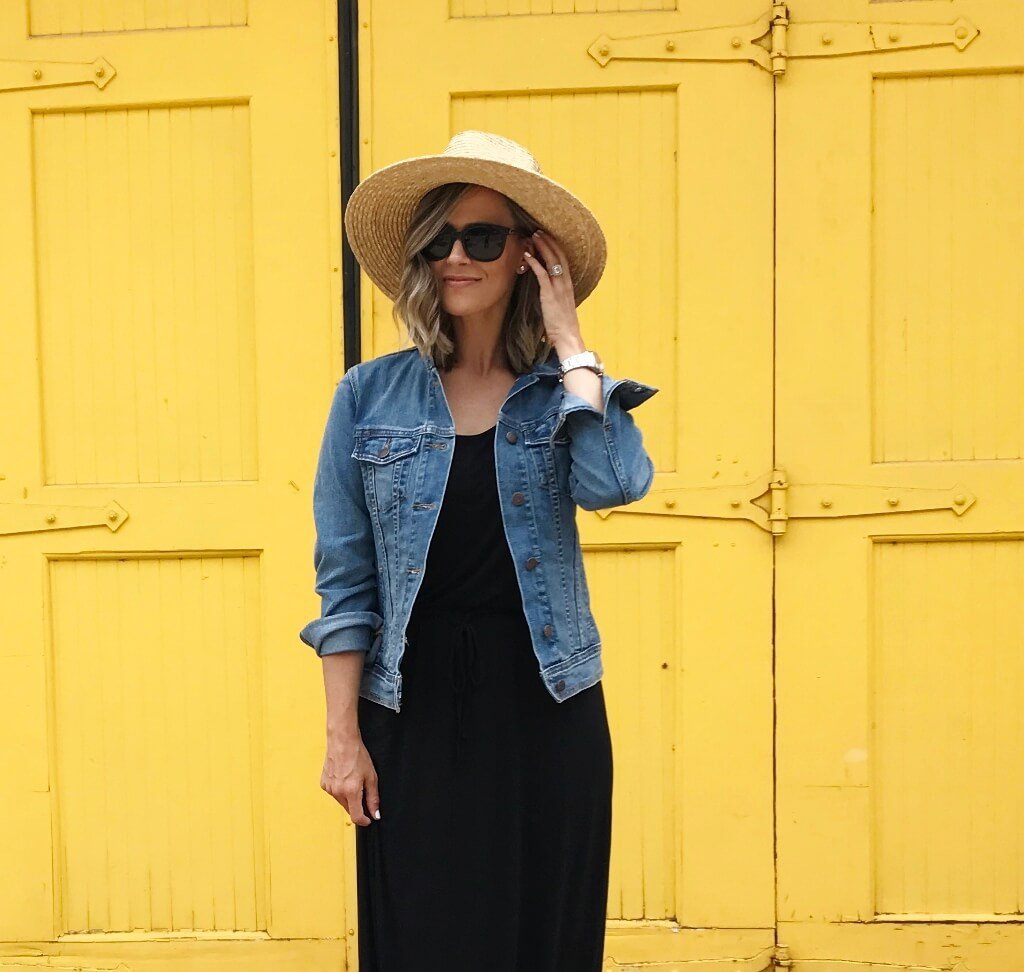 Black maxi dress, denim jacket, straw hat