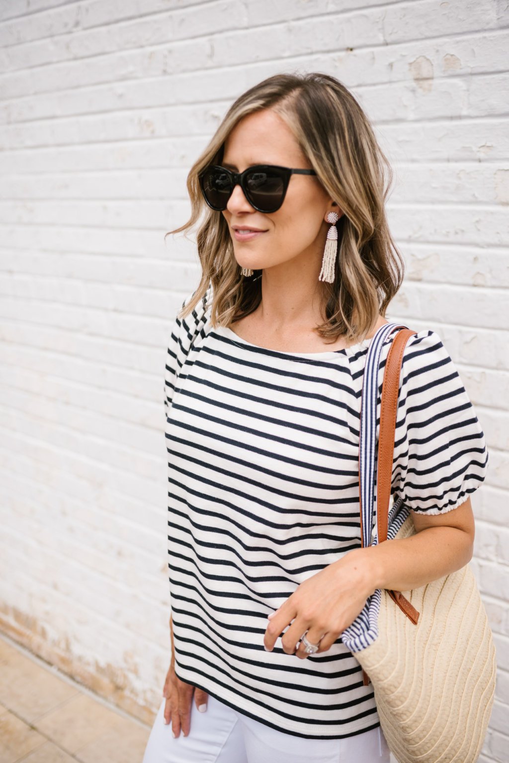 Striped tee, white denim, flip flops, sunglasses, and tote