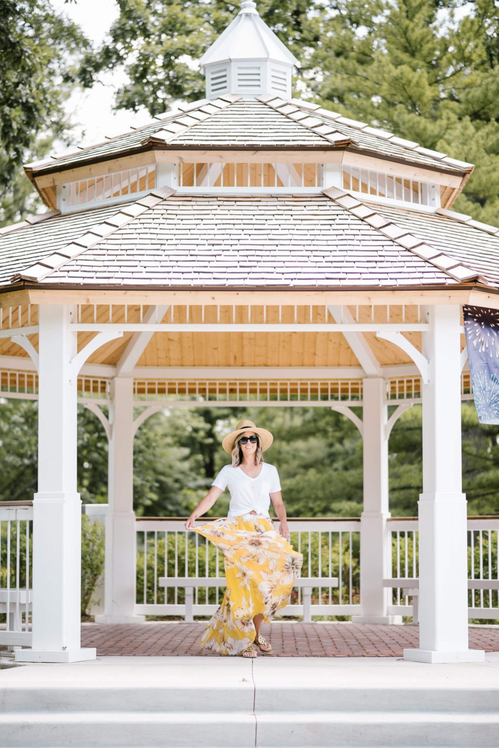 Summer style: floral maxi skirt, white tee, straw hat, sunglasses, sandals