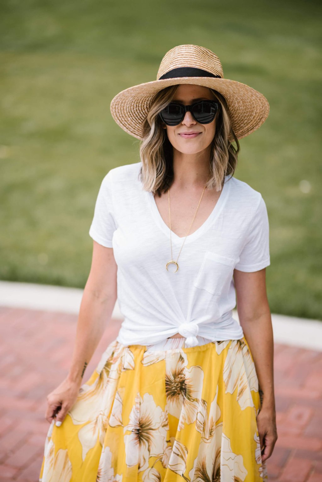 Summer style: floral maxi skirt, white tee, straw hat, sunglasses, sandals