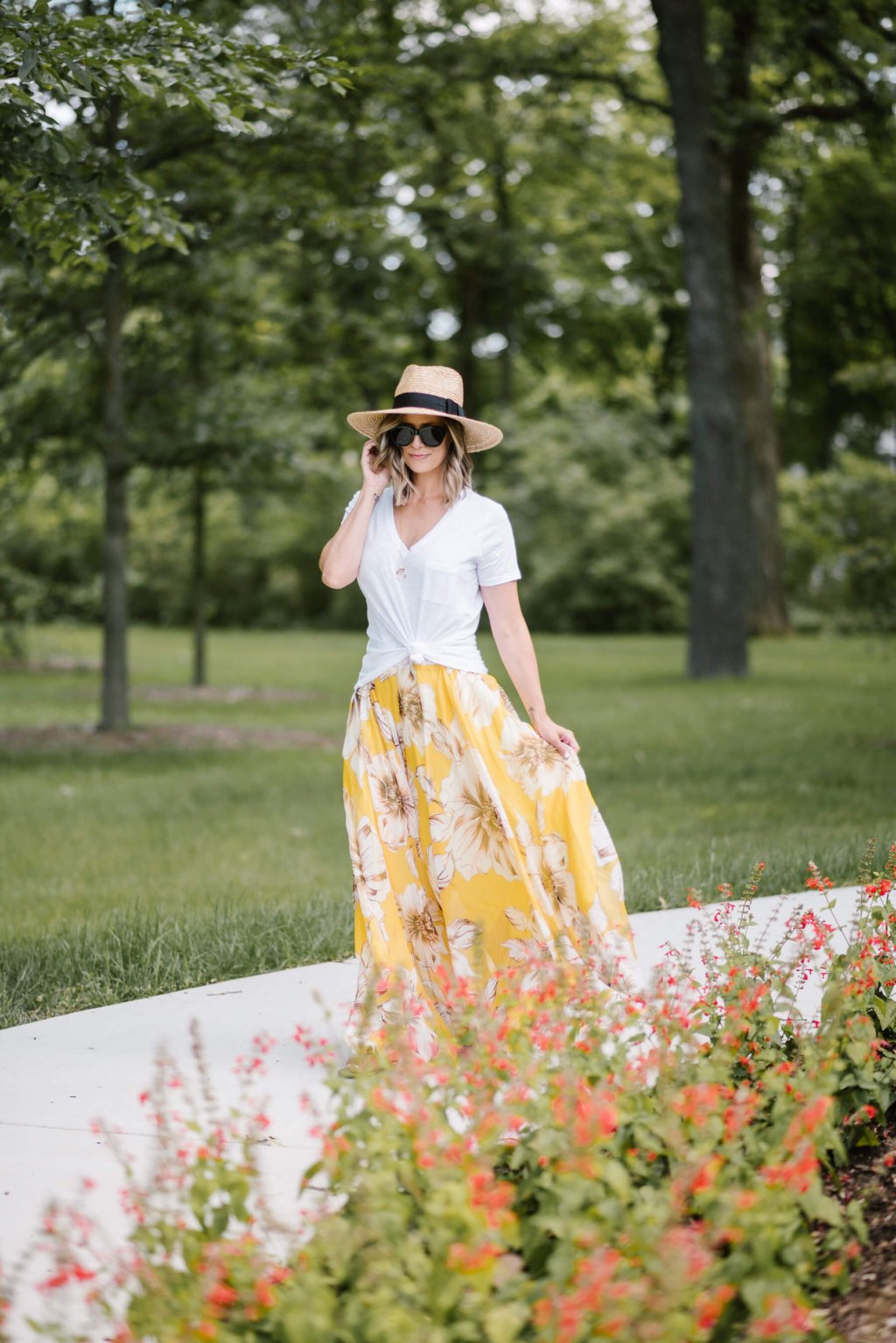 Summer style: floral maxi skirt, white tee, straw hat, sunglasses, sandals