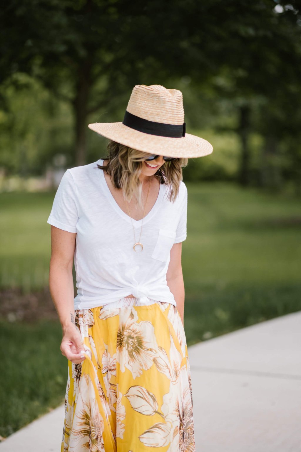Summer style: floral maxi skirt, white tee, straw hat, sunglasses, sandals