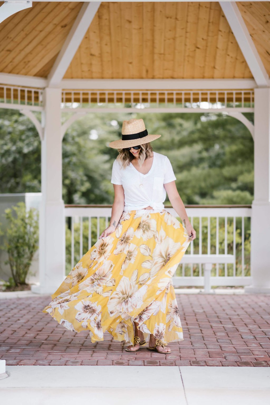 Summer style: floral maxi skirt, white tee, straw hat, sunglasses, sandals
