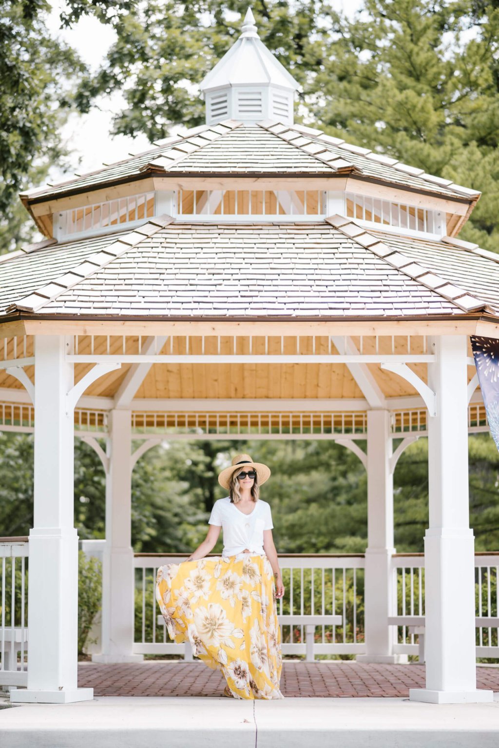 Summer style: floral maxi skirt, white tee, straw hat, sunglasses, sandals