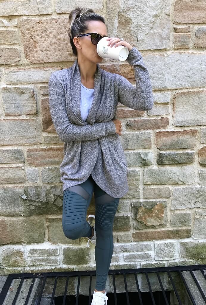 Sweater, moto leggings, tote, sneakers, and sunglasses