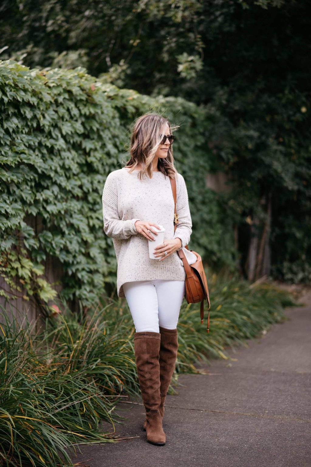 Sweater, white denim, over the knee boots, cross body bag