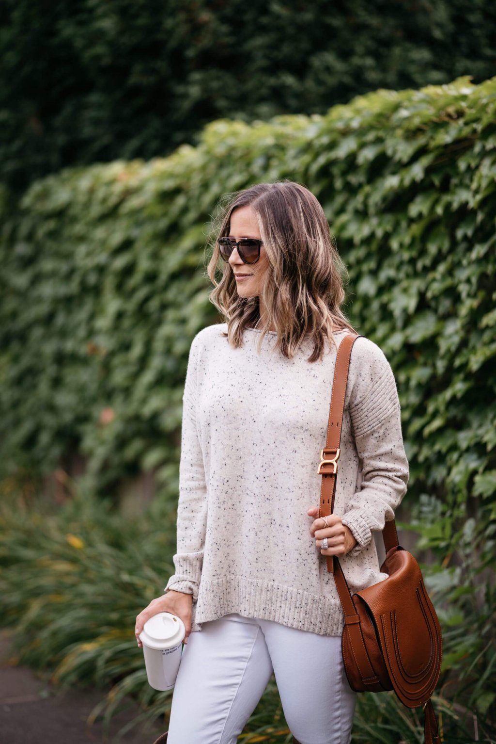 Sweater, white denim, over the knee boots, cross body bag
