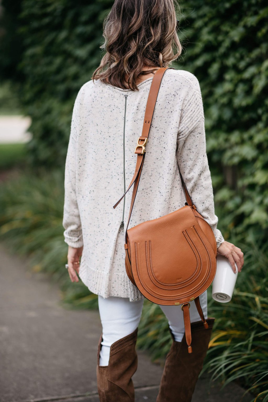 Sweater, white denim, over the knee boots, cross body bag
