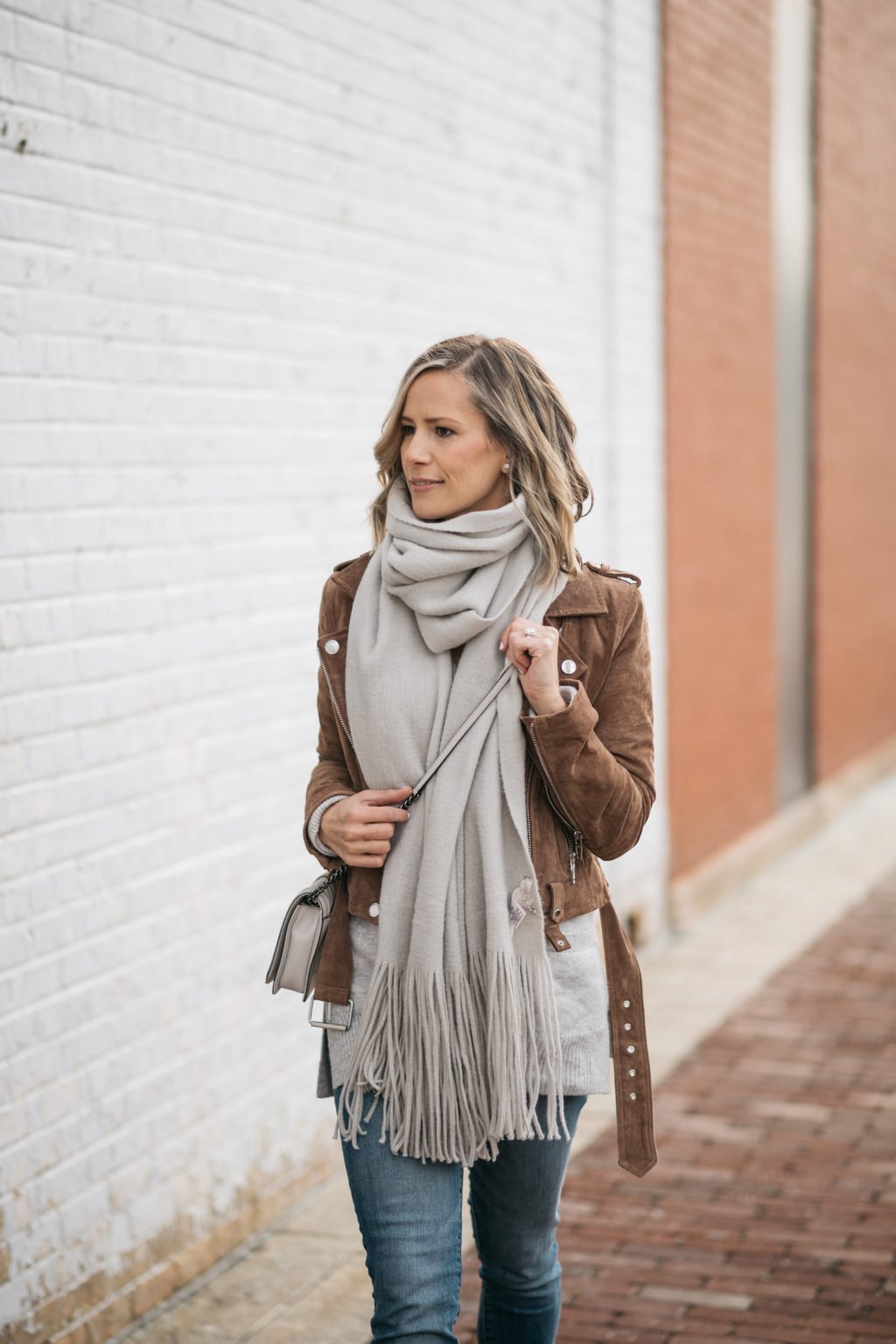 Brown suede moto jacket, sweater, scarf, denim, cross body, booties