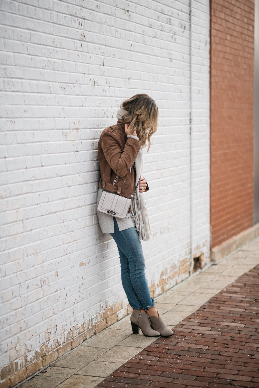Suede jacket, sweater, scarf, cross body bag, denim jeans, booties