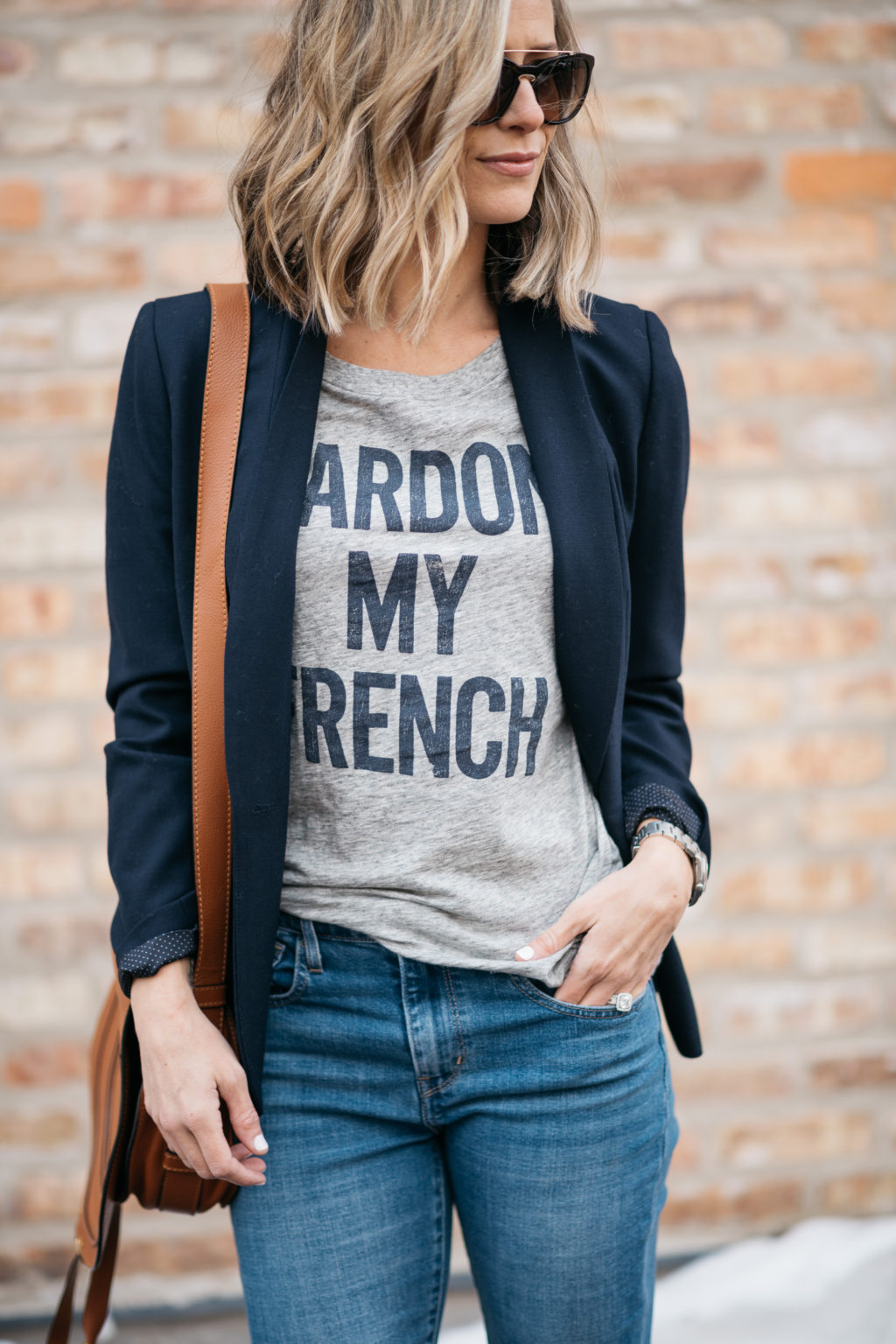 Blazer, graphic tee, sunglasses, denim, crossbody, sneakers