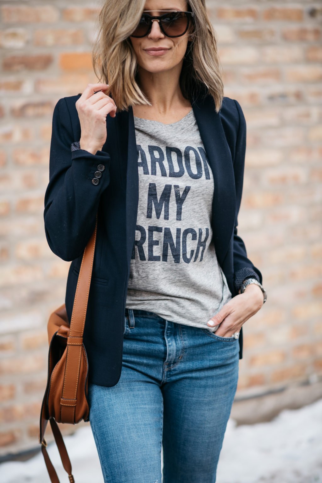 Blazer, graphic tee, sunglasses, denim, crossbody, sneakers
