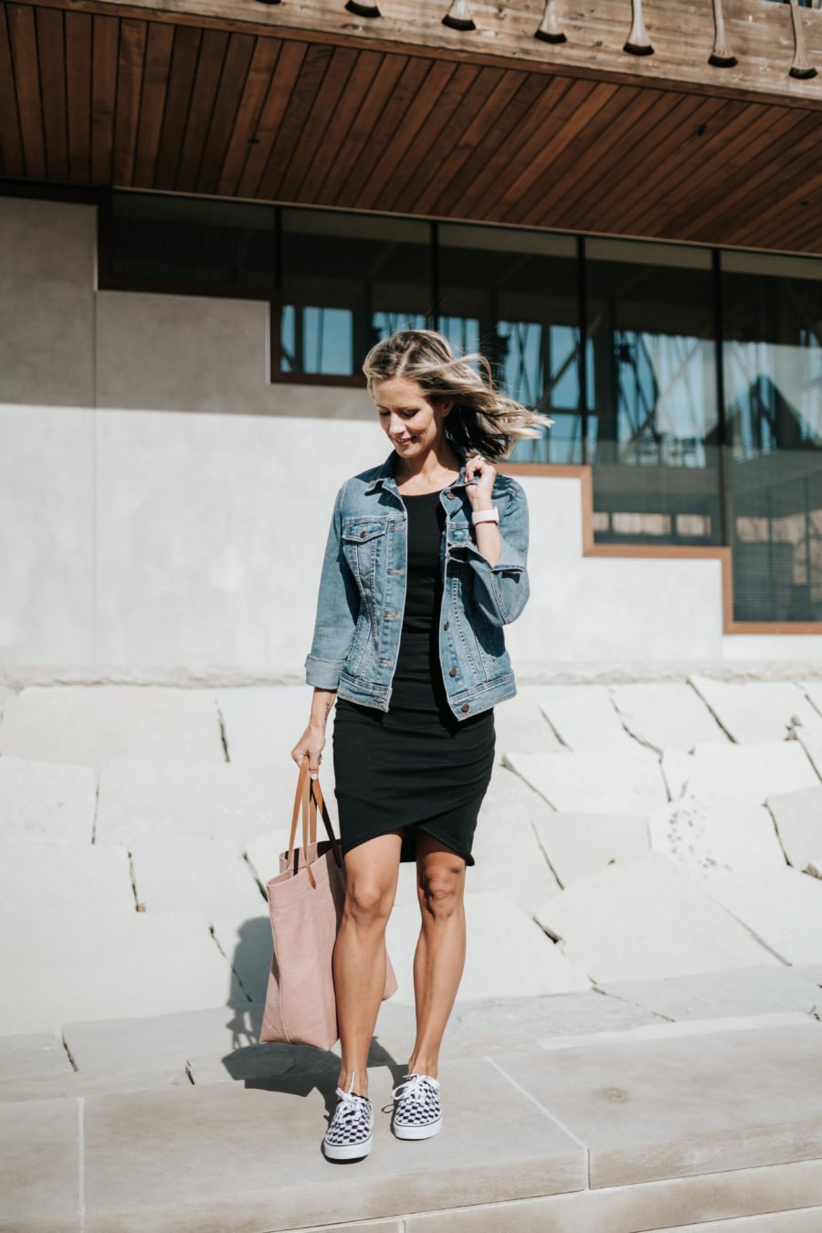 Daytime to date night: tank dress, denim jacket, pink tote, sneakers