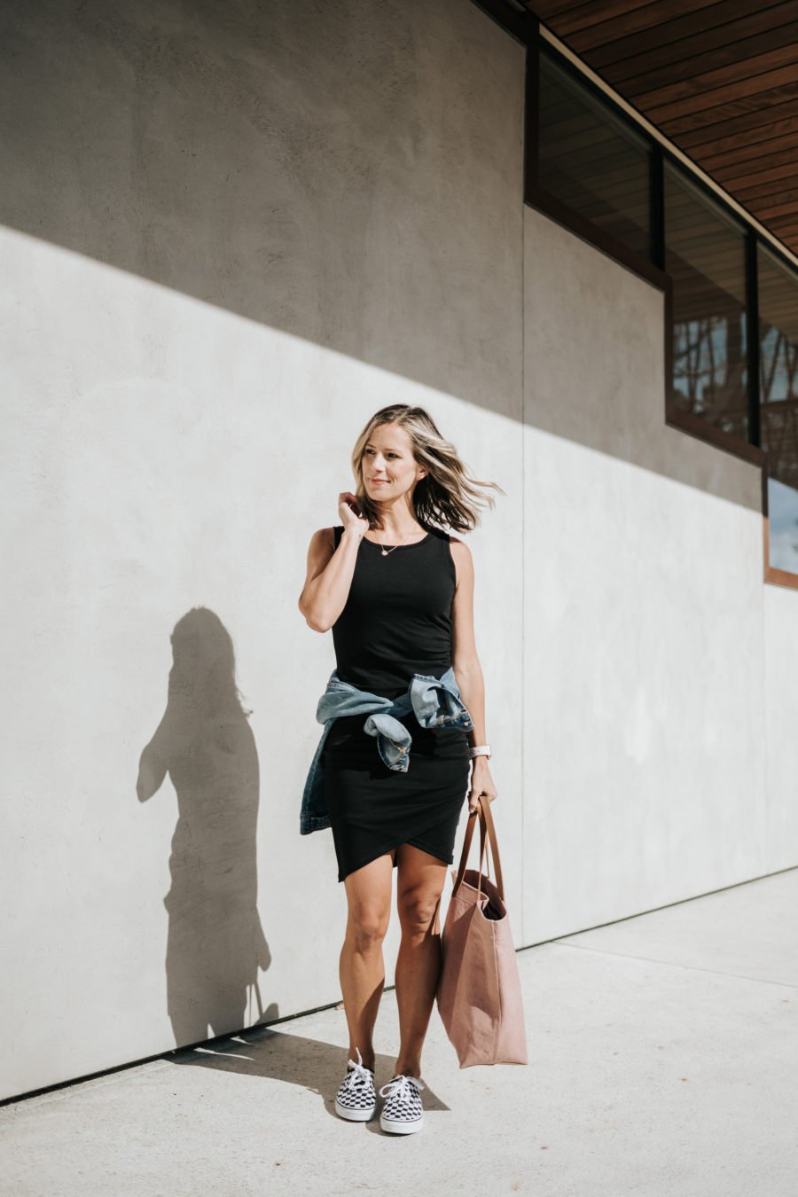 Daytime to date night: tank dress, denim jacket, pink tote, sneakers