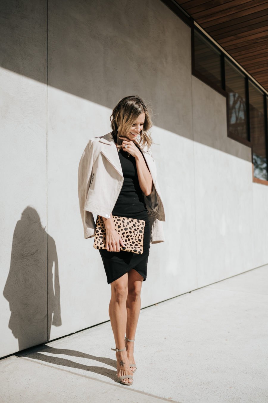 Daytime to date night: tank dress, suede jacket, heels, leopard clutch