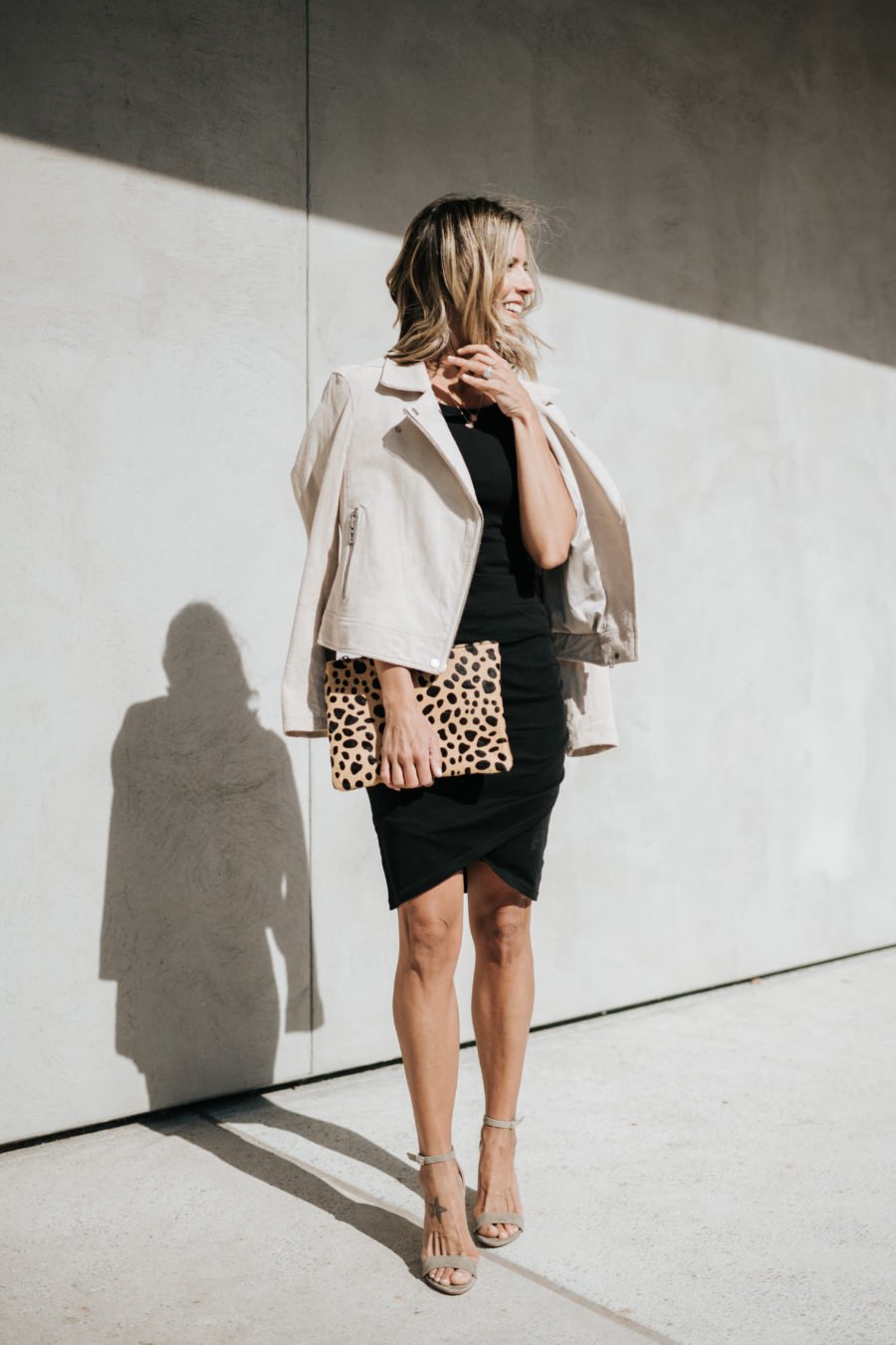 Daytime to date night: tank dress, suede jacket, heels, leopard clutch