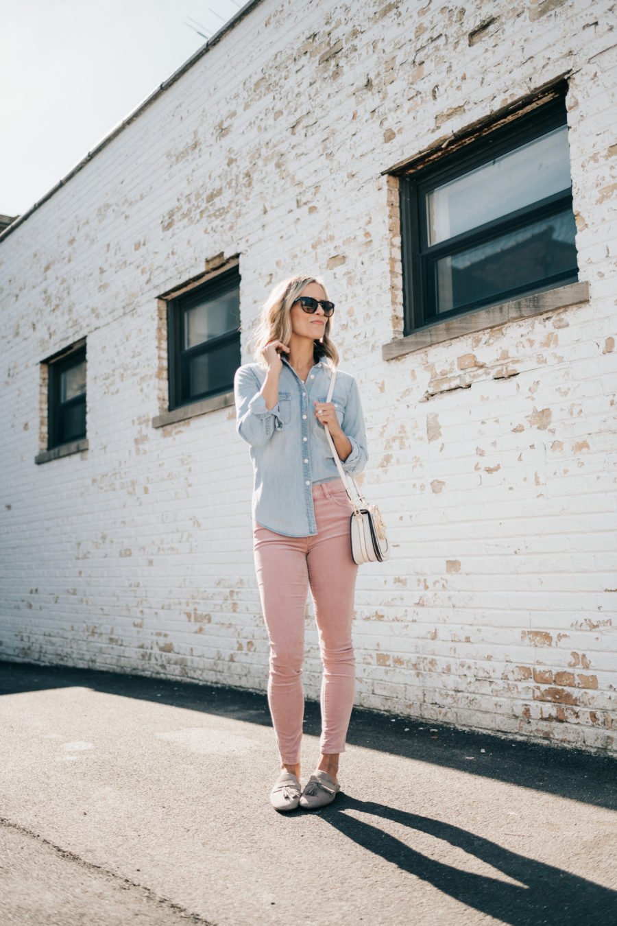 Denim shirt, pink jeans, Chloe dupe bag, sunglasses, and mules