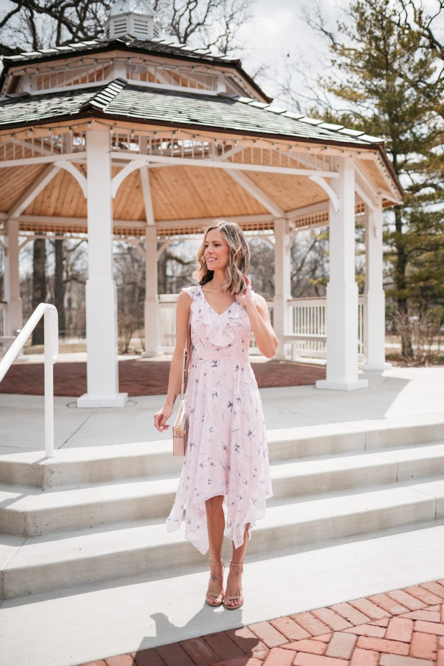 Purple floral party dress, nude strappy heels, cross body bag