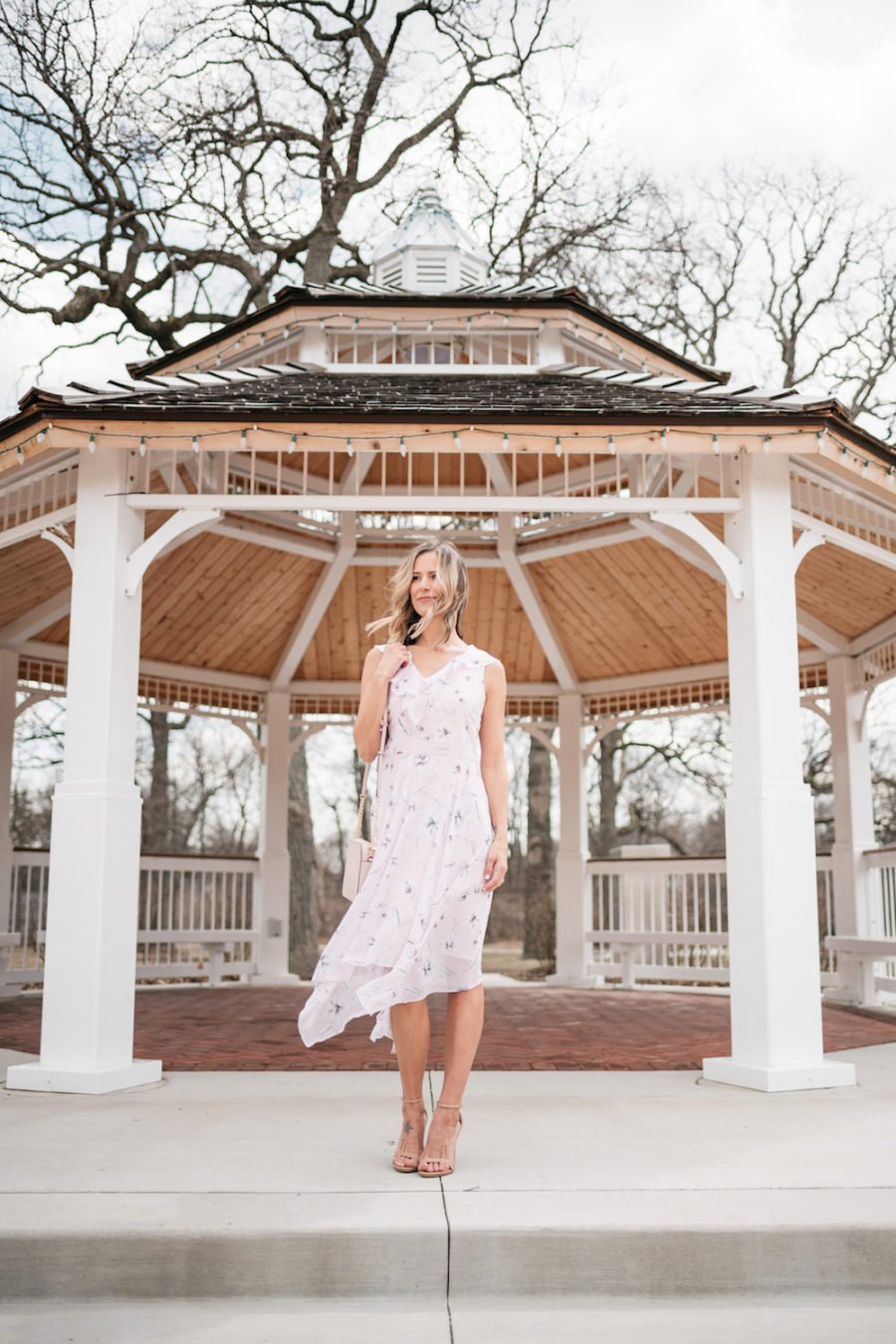 Purple floral party dress, nude strappy heels, cross body bag
