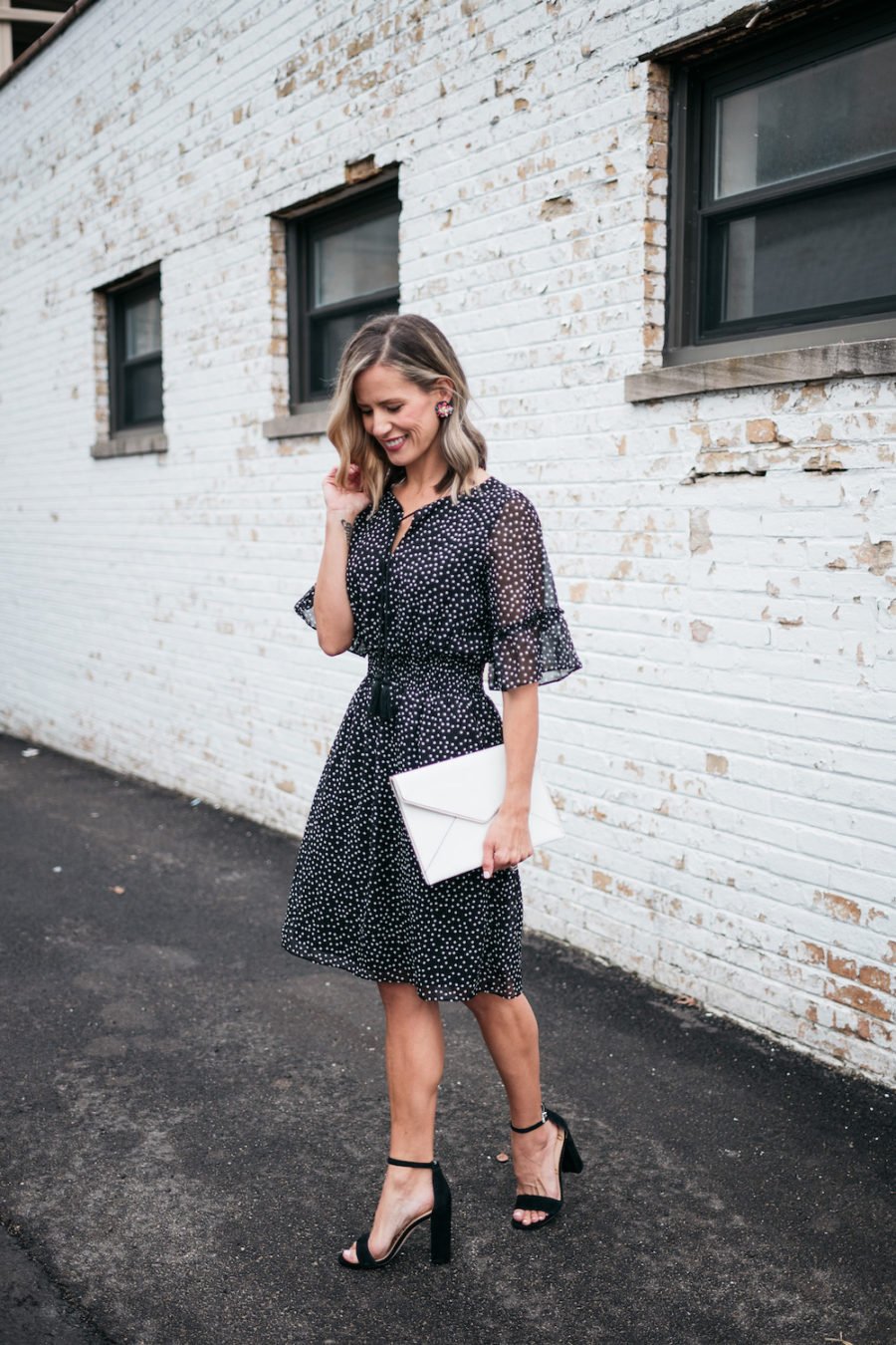 polka dots and ruffle spring dress, white clutch, black heels