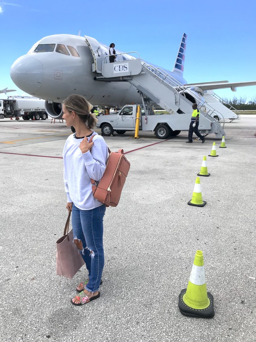 Travel style, sweatshirt, denim, slides, and backpack