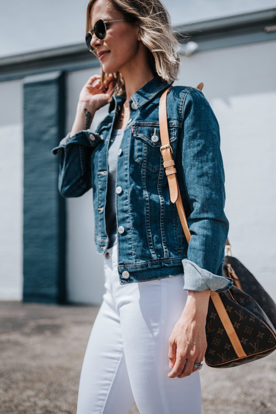 White jeans, striped tank, espadrilles, denim jacket, Louis Vuitton bag, sunglasses