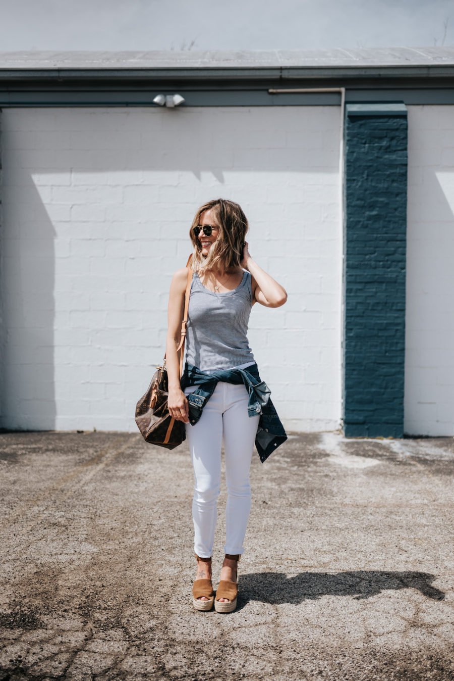 White jeans, striped tank, espadrilles, denim jacket, Louis Vuitton bag, sunglasses