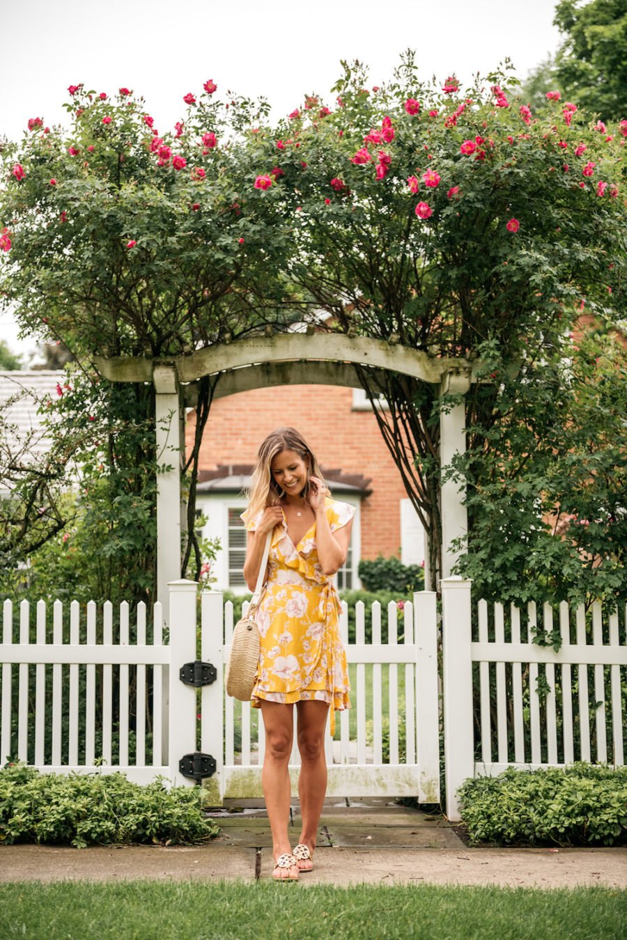Floral dress, straw bag, straw hat, sandals