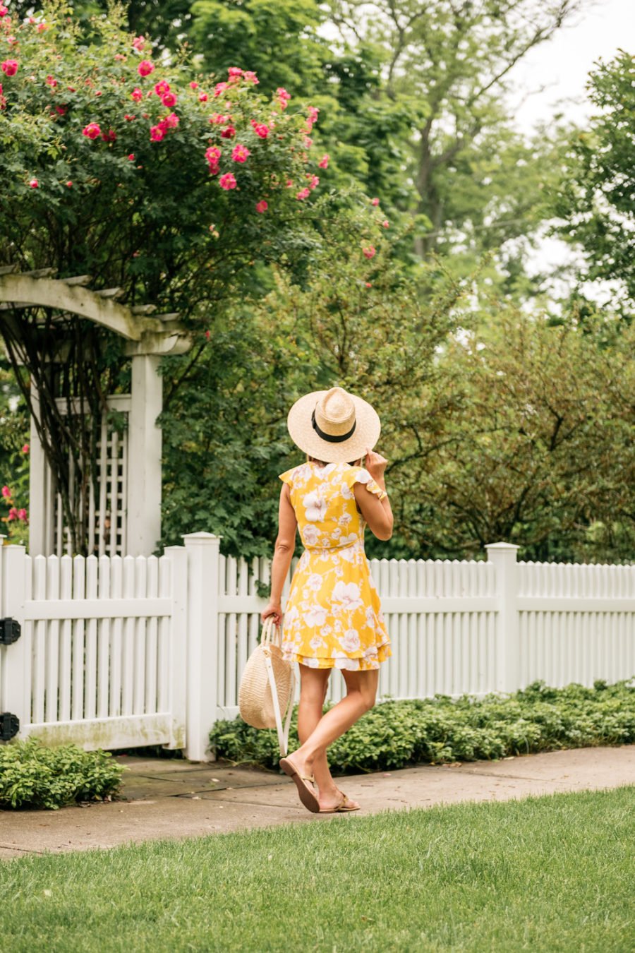 Floral dress, straw bag, straw hat, sandals