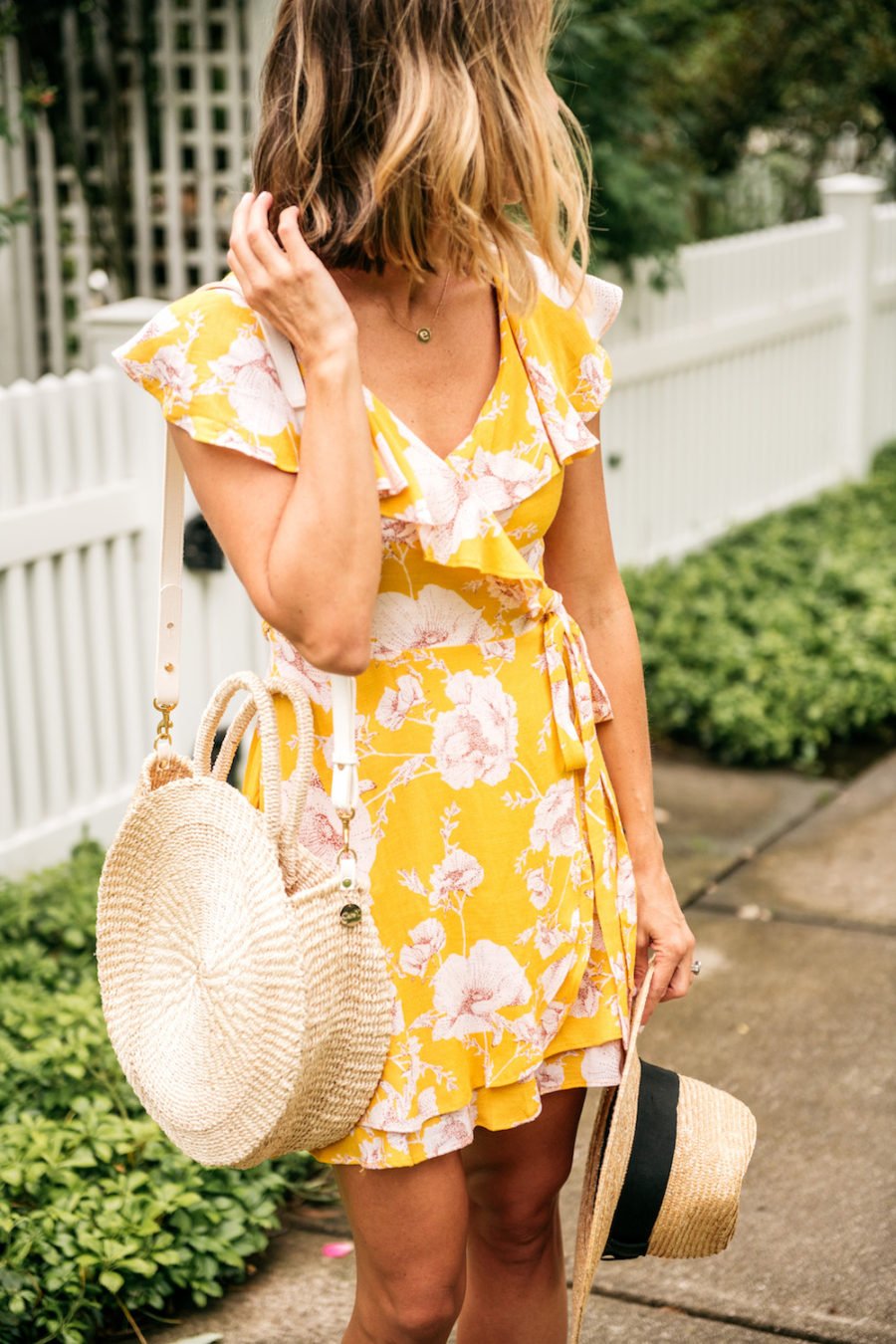 Floral dress, straw bag, straw hat