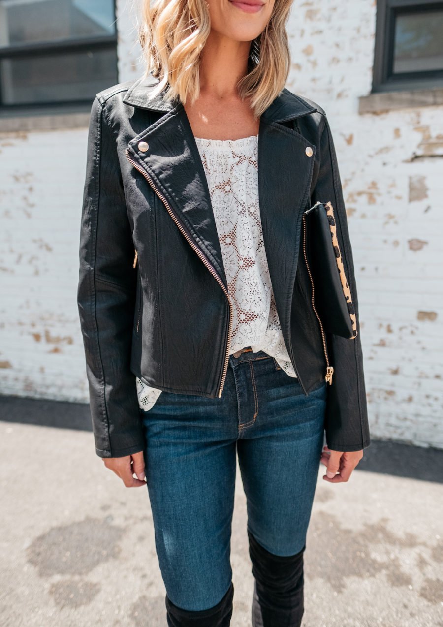 White blouse, denim jeans, moto jacket, over the knee boots