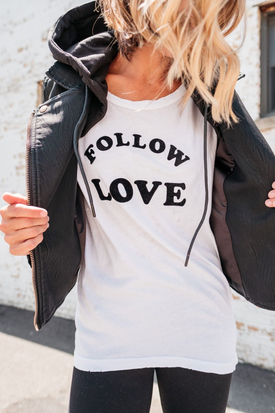 Graphic tee, leggings, moto jacket, Converse