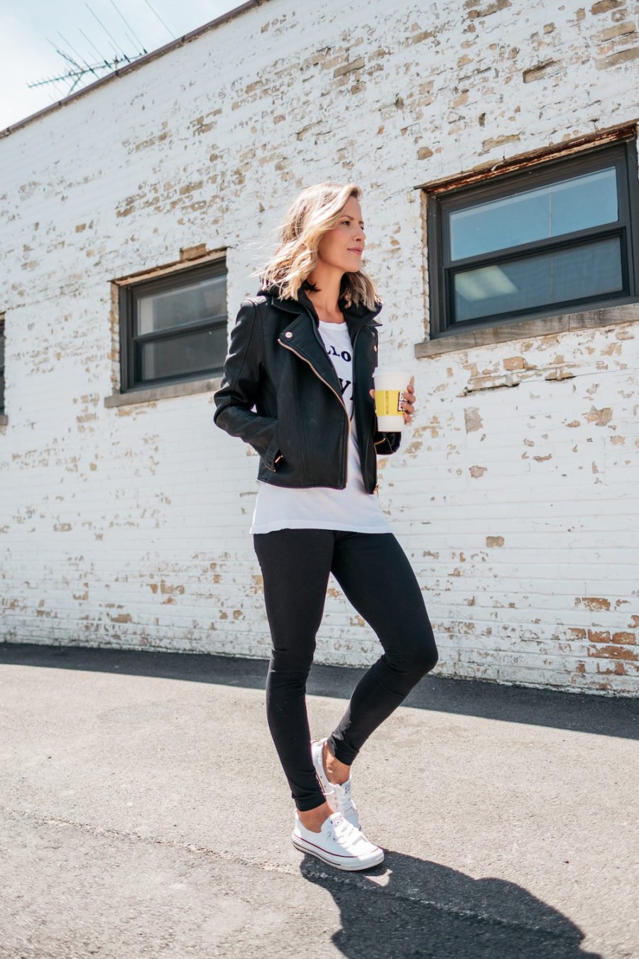 Graphic tee, leggings, moto jacket, Converse