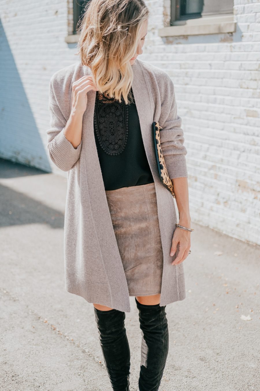 Cardigan, black top, brown suede skirt, leopard bag, over the knee boots