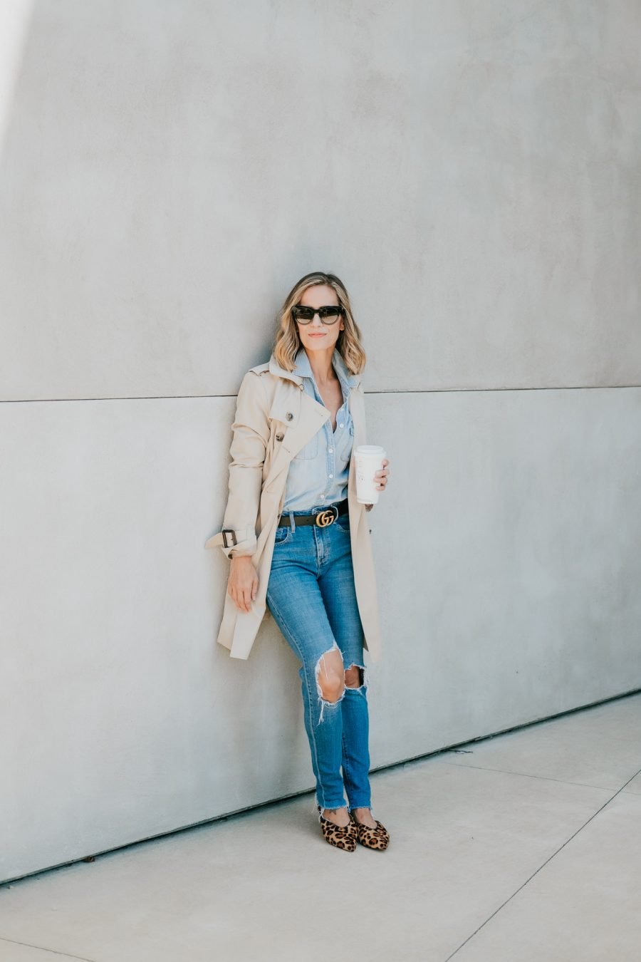 Denim on denim, Gucci belt, sunglasses, leopard flats, and trench coat