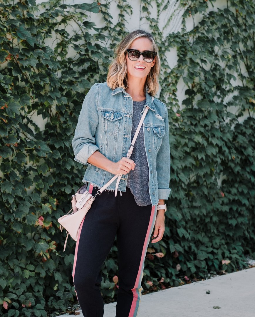 Wildfox sweatpants, tee, denim jacket, New Balance sneakers, cross body bag