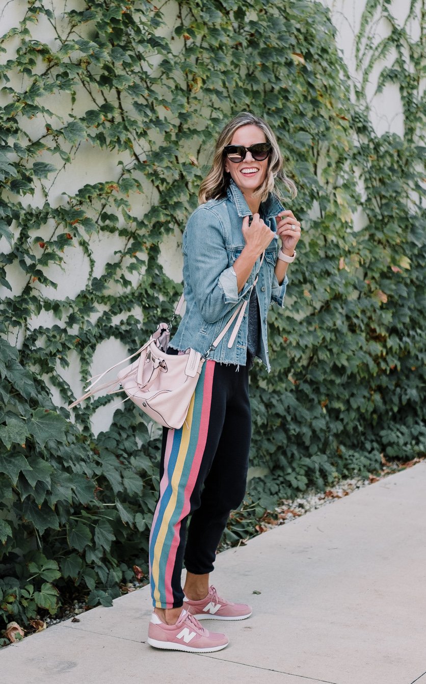 Wildfox sweatpants, tee, denim jacket, New Balance sneakers, cross body bag