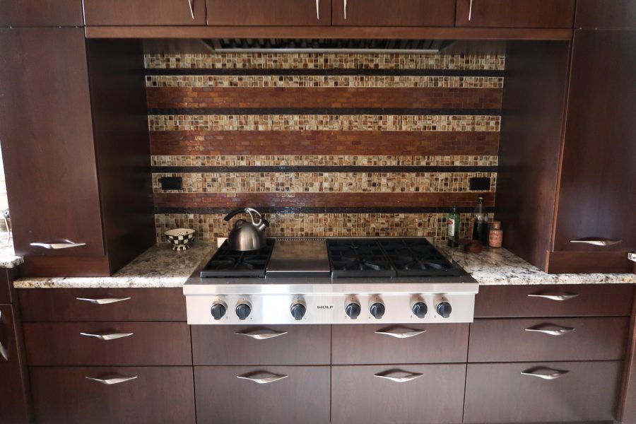 Our current kitchen, dark wood cabinets and granite countertops